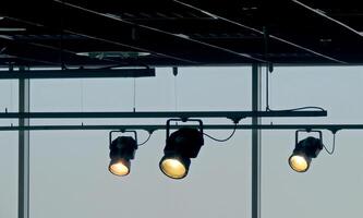 Tracking spotlights shines on the ceiling rail system photo