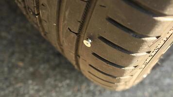 Vehicle Tire Punctured By The Screw photo
