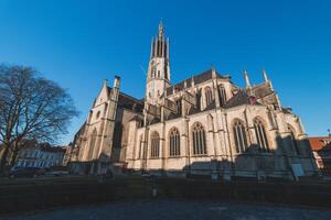 Basilica of Hulst. An ancient cathedral with a unique tower in the Dutch town of Hulst. The landmark of the city photo