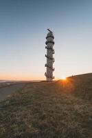 Radar Ossenisse under the sunrise rays in the south of the Netherlands. Security tower for the protection of the Holland photo