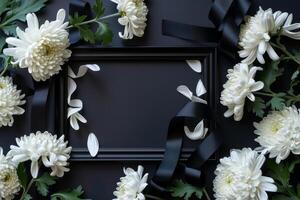 A flower frame with white petals and black ribbons on a dark background. Perfect for Sympathy card. photo