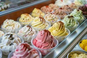 An assortment of various ice cream flavors in a display case photo