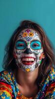 Cinco de Mayo. A woman with sugar skull makeup on her forehead is smiling photo
