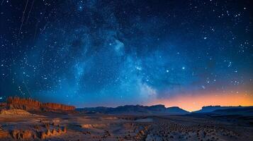 Stars trailing in the night sky over a silent desert photo