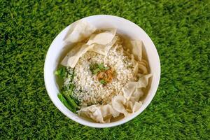 A Bowl of Stir Fried Noodles on Grass photo