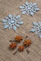 Snowflakes on textile background. Winter holidays concept photo