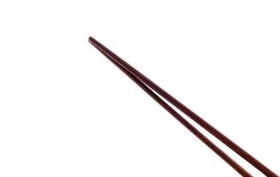 Wooden chopsticks on the white photo