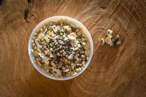 Plate with muesli on a wooden table photo