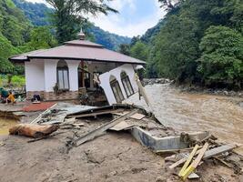 Tanah Datar, Indonesia - May 12, 2024. condition of the mosque affected by cold lava flash floods. Natural Disaster in Lembah Anai, Sepuluh Koto District, Tanah Datar, West Sumatra, Indonesia photo