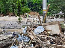 Tanah Datar, Indonesia - May 12, 2024. Piles of rubbish after cold lava flash flood, natural disaster in Anai Valley, Sepuluh Koto, Tanah Datar Regency, West Sumatra, Indonesia photo