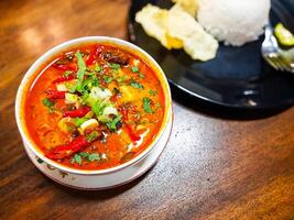 Beef Tongseng food, an Indonesian dish made from boiled beef in a curry-like sauce or soup with vegetables photo