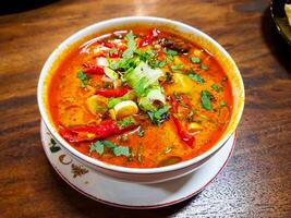 Beef Tongseng food, an Indonesian dish made from boiled beef in a curry-like sauce or soup with vegetables photo