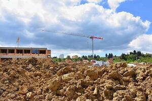 Crane and construction of new buildings. Beautiful background for the construction industry photo