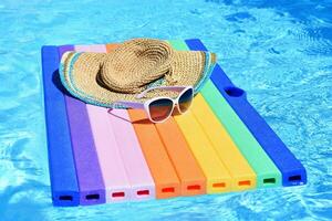 Pool and lounger with clean water. Summer background for traveling and vacation. photo