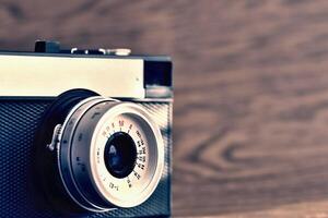 Russian old analog camera on a wooden background. photo