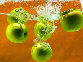 Green apples in water photo