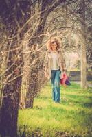 Fashion shot of a beautiful boho style girl on nature background. Boho, hippie. photo