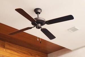 Wooden ceiling fan. Modern room cooling device with speed control. Summer and heat in the room. photo