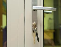 it put door with glass c by keys in the lock photo
