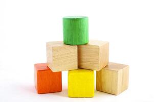 Wooden toy blocks on white background photo