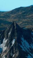 A view of a mountain range with snow on it video