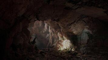 A dark and rugged cave filled with natural rock formations and earthy textures video