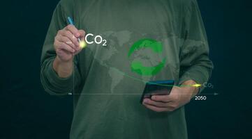 Carbon Dioxide Reduction To solve the global climate crisis and reduce global warming. Concept of reducing carbon dioxide emissions to zero for the goal of reducing greenhouse gas emissions in 2050 photo