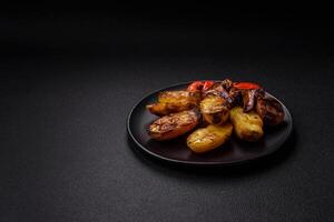 Delicious juicy grilled vegetables potatoes, tomatoes, peppers, eggplant photo