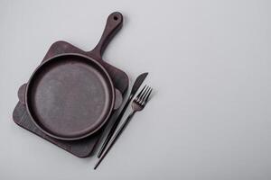 An empty plate on a gray concrete background with copy space photo