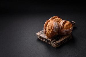 Fresh baked bread buns with salt, spices, seeds and grains photo