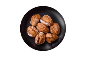 Fresh baked bread buns with salt, spices, seeds and grains photo