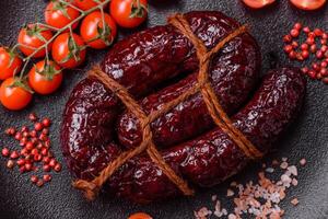 Delicious black blood sausage or black pudding with spices and herbs photo