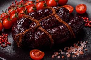 Delicious black blood sausage or black pudding with spices and herbs photo