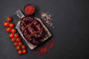 Delicious black blood sausage or black pudding with spices and herbs photo