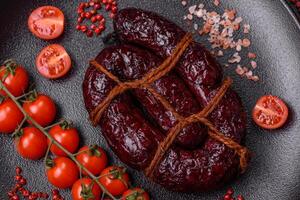 Delicious black blood sausage or black pudding with spices and herbs photo