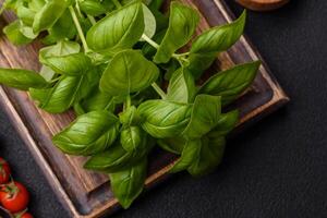 Fresh herbs basil in the form of a bush as an ingredient for cooking at home photo