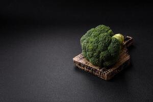 Fresh raw green broccoli in the form of a branch as an ingredient for cooking food at home photo