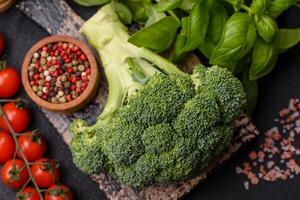 Fresh raw green broccoli in the form of a branch as an ingredient for cooking food at home photo