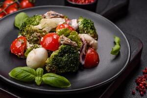 Delicious fresh juicy salad with quail eggs, cherry tomatoes, lettuce leaves photo