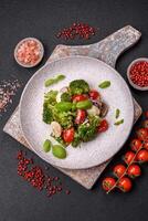 Delicious fresh juicy salad with quail eggs, cherry tomatoes, lettuce leaves photo