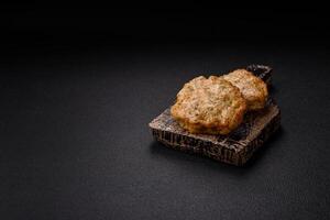 Delicious fried minced chicken cutlets with salt, spices and herbs photo
