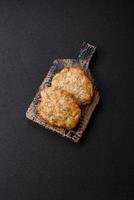 Delicious fried minced chicken cutlets with salt, spices and herbs photo