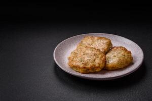 Delicious fried minced chicken cutlets with salt, spices and herbs photo