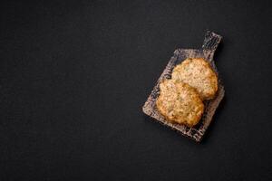 Delicious fried minced chicken cutlets with salt, spices and herbs photo