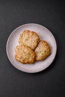 Delicious fried minced chicken cutlets with salt, spices and herbs photo