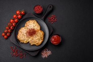 Delicious fried minced chicken cutlets with salt, spices and herbs photo