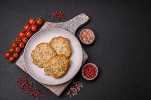 Delicious fried minced chicken cutlets with salt, spices and herbs photo