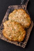 Delicious fried minced chicken cutlets with salt, spices and herbs photo