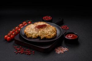 Delicious fried minced chicken cutlets with salt, spices and herbs photo