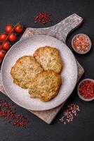 Delicious fried minced chicken cutlets with salt, spices and herbs photo